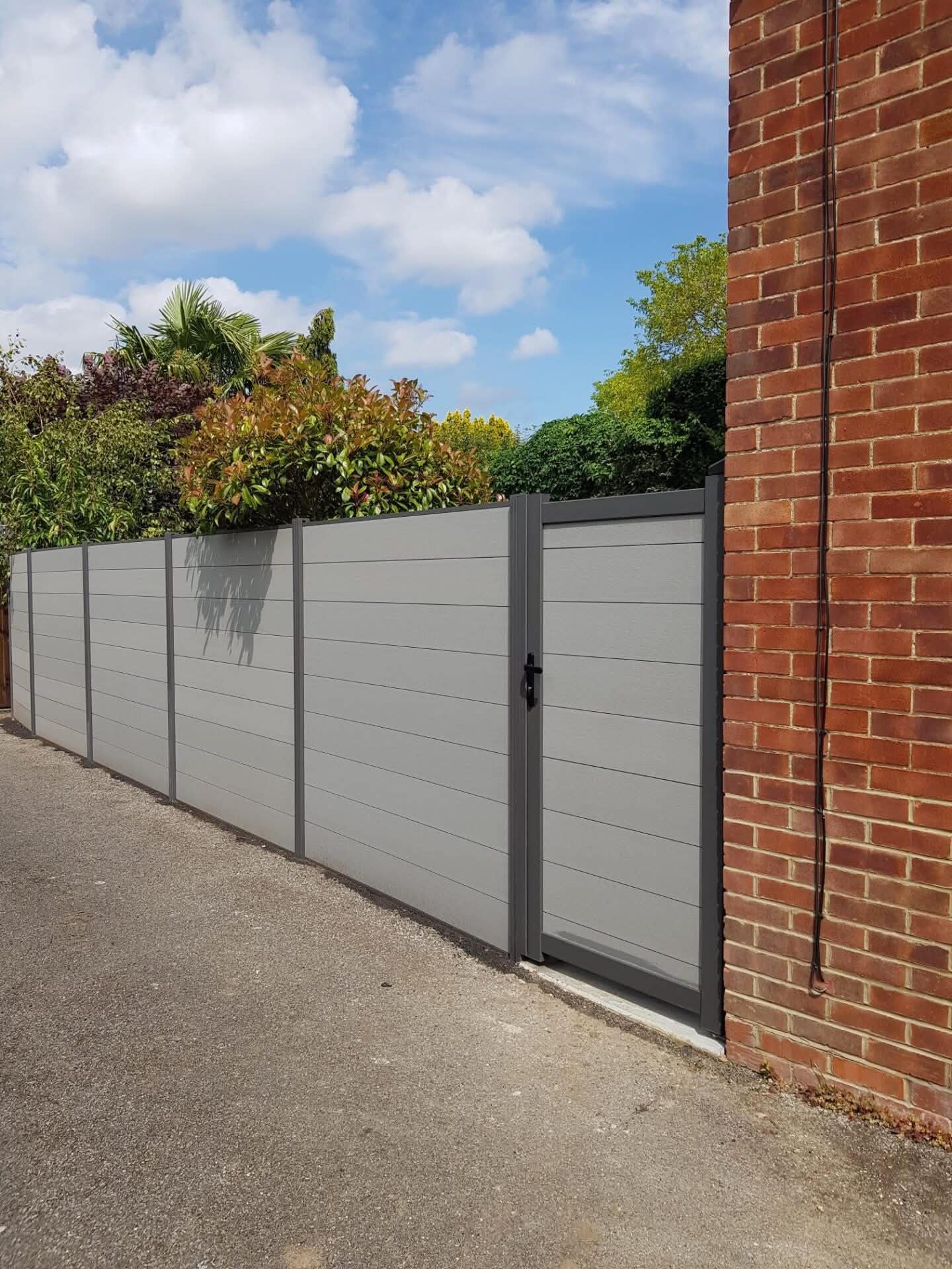 Contemporary grey composite fencing and gate
